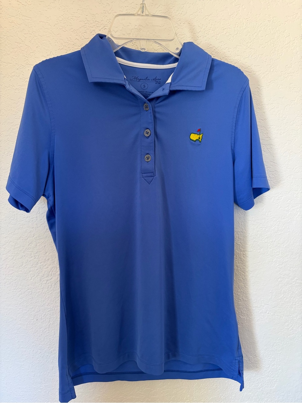 Magnolia Lane Women’s golf masters polo in blue.